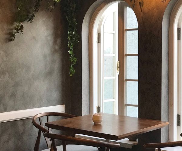 Cozy corner with a yoga mat, a plant, and soft morning light.